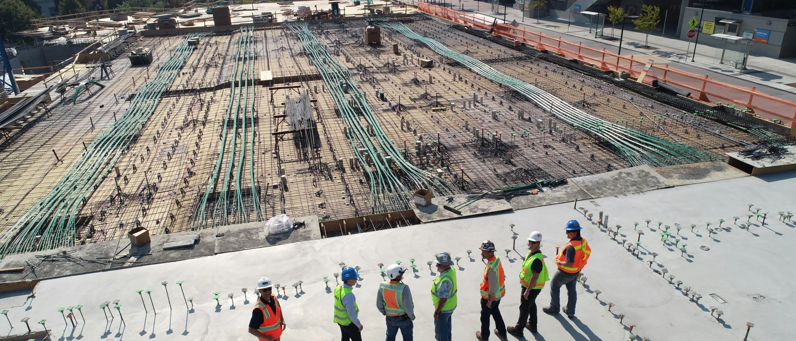 Construction crew working on a large concrete slab