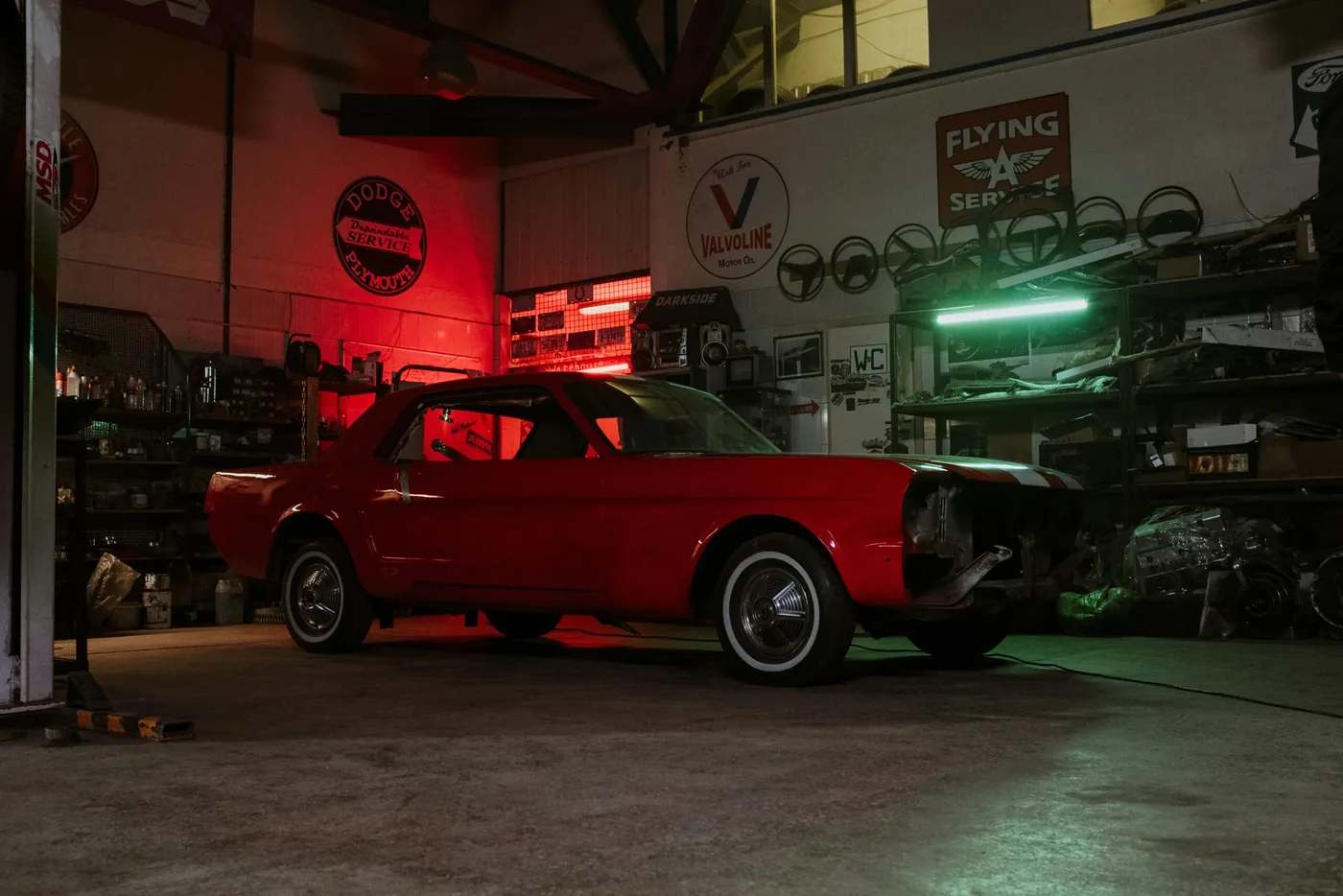 A classic Ford Mustang parked inside a garage